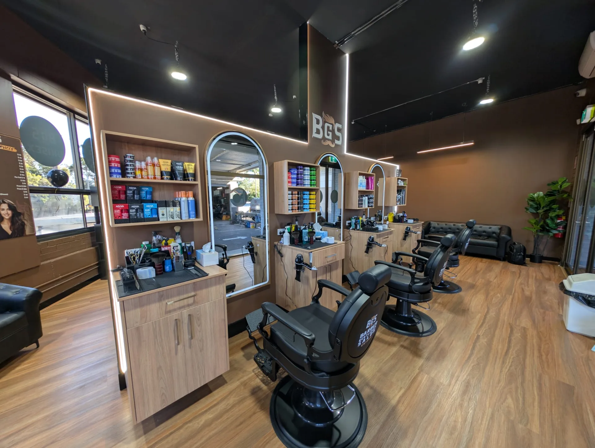 Product shelves and lit arched mirrors under the BGS mark in daylight